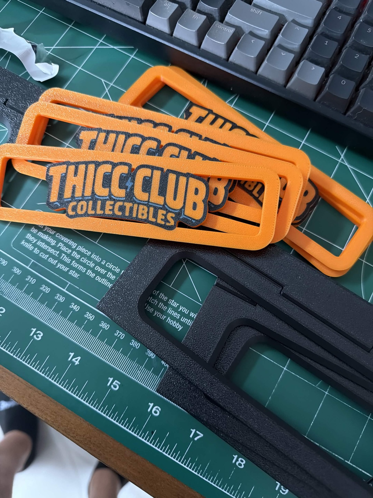 Orange and black Thicc Club Prints risers fresh off the print bed