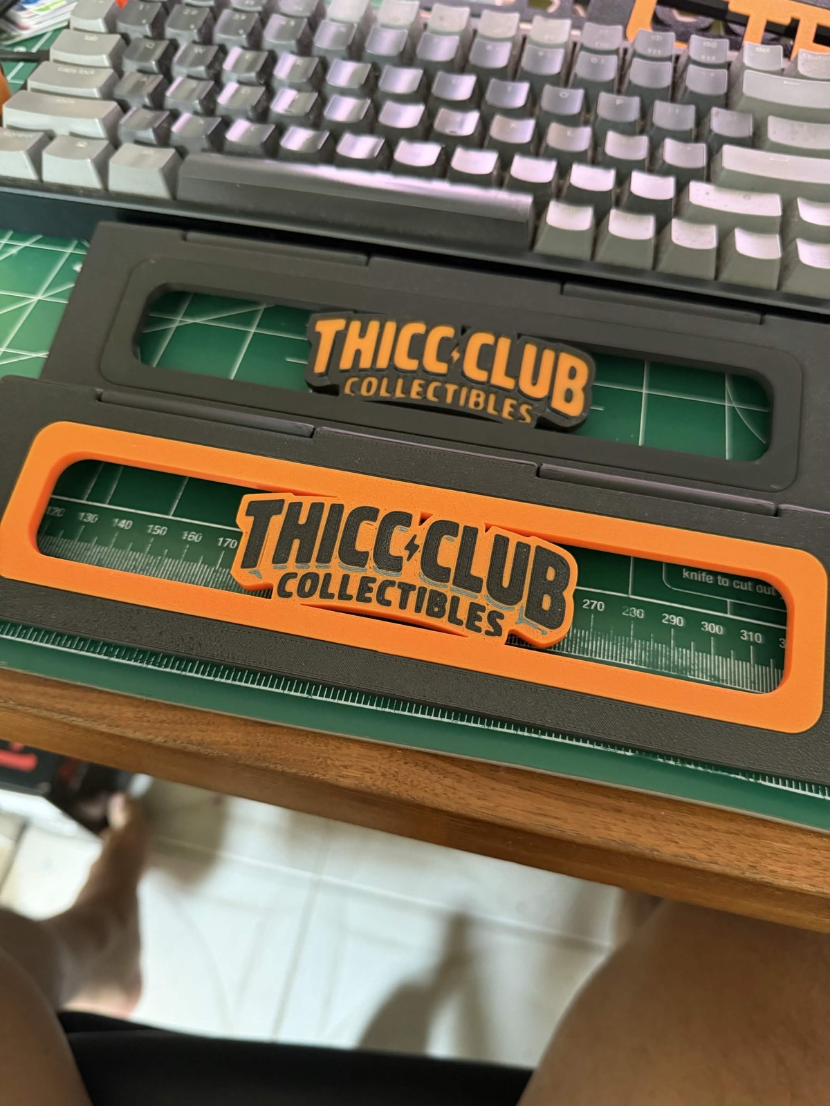 Detail shot of a single orange and black riser with logo