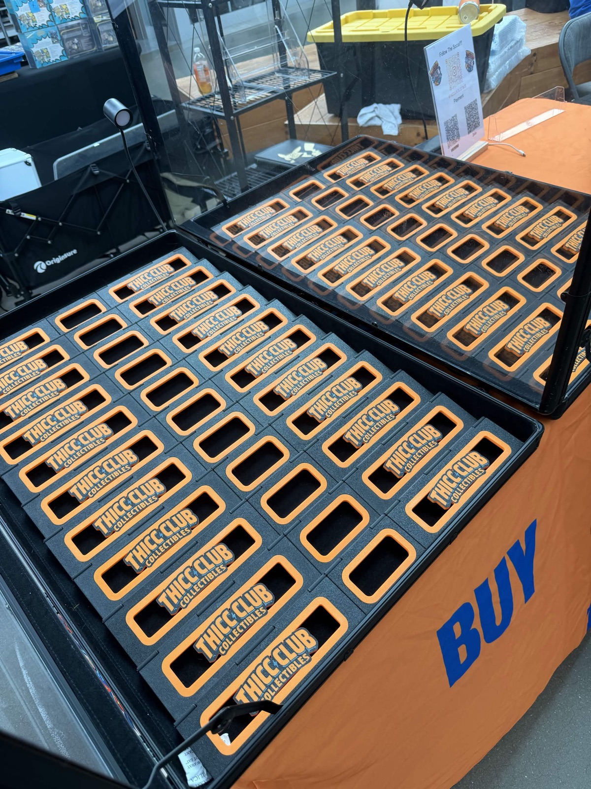 Rows of Thicc Club Prints risers arranged in display cases