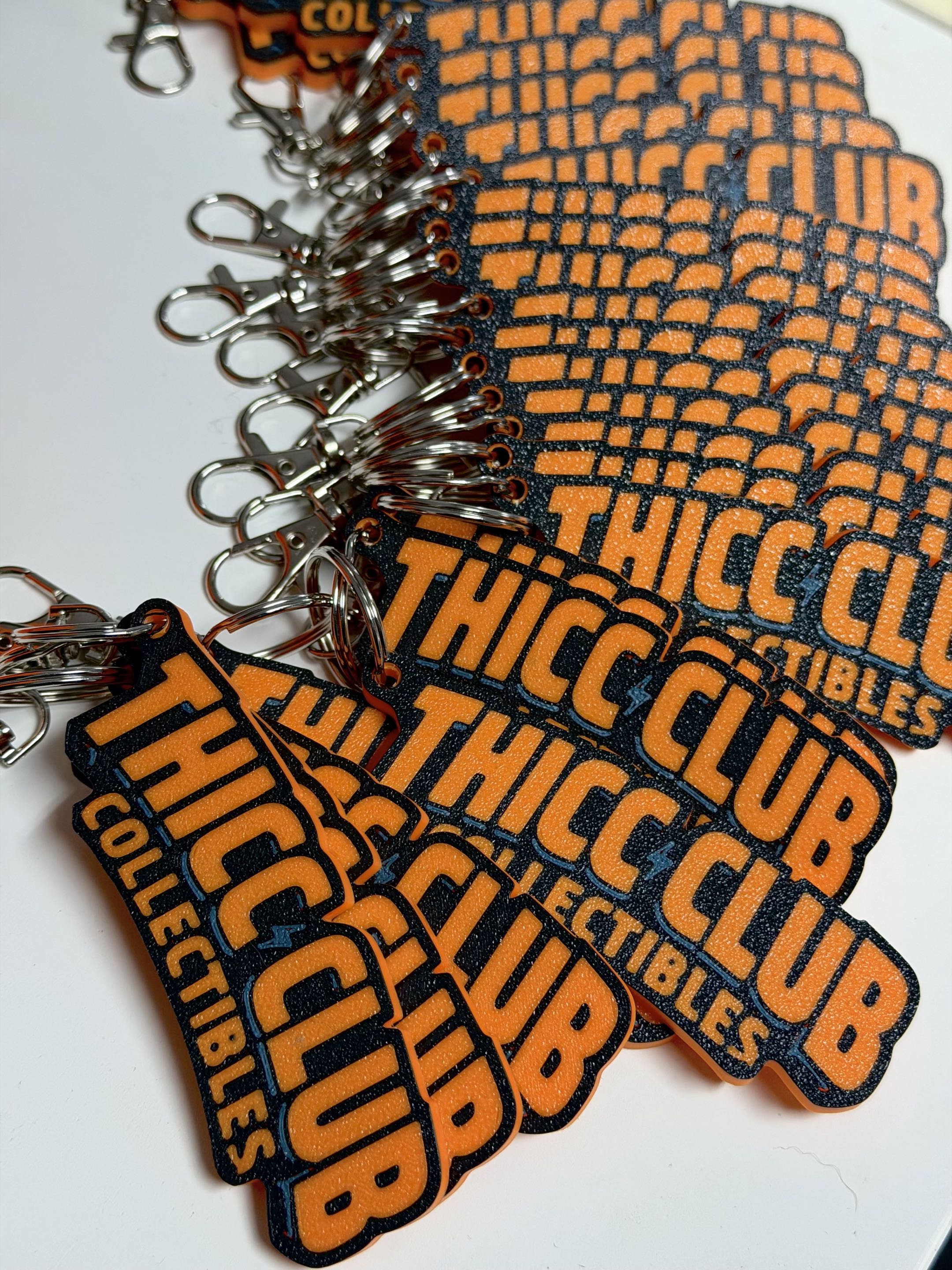 Thicc Club Prints display booth with risers and nameplates on show